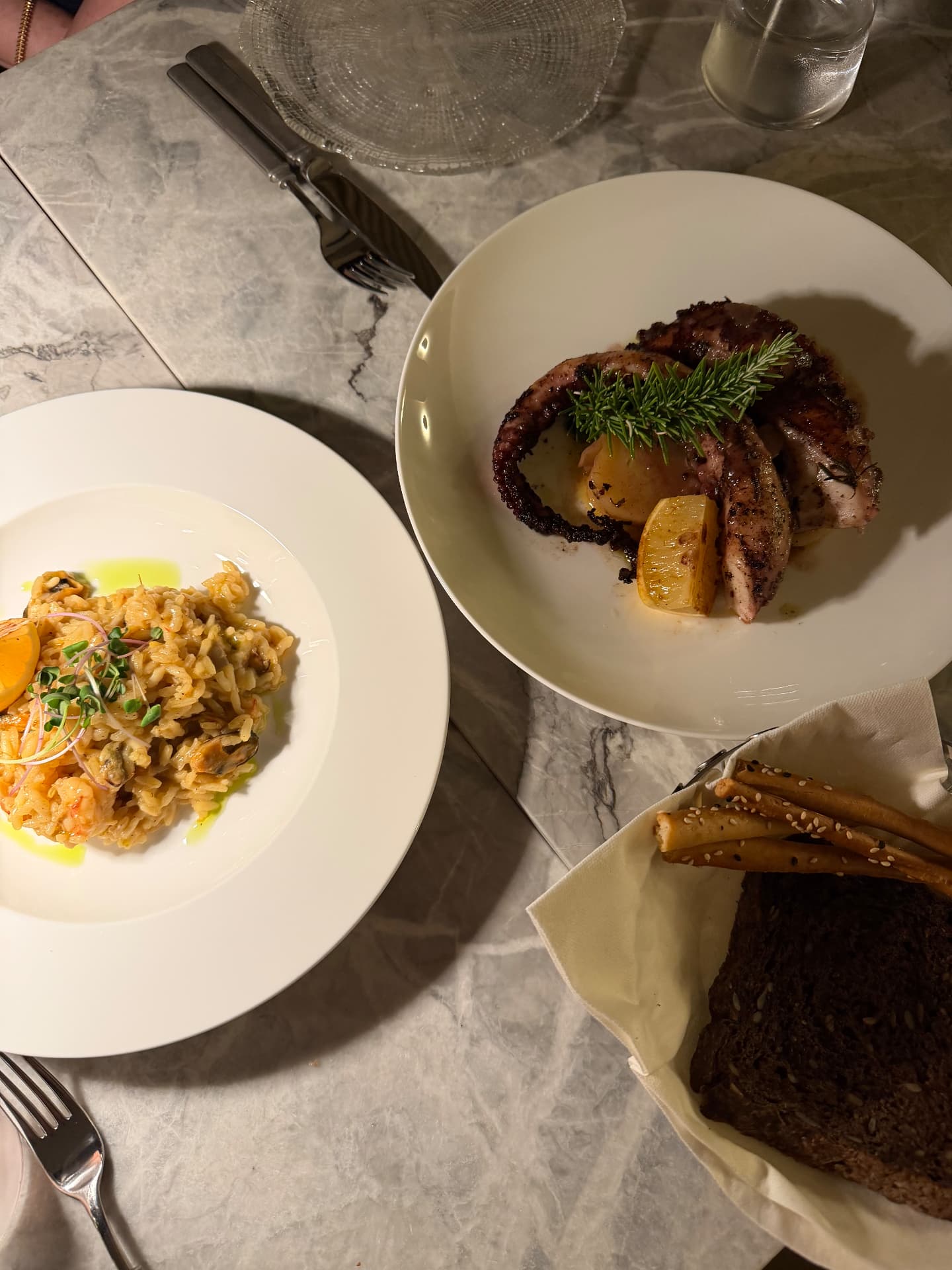 Seafood risotto and grilled octopus served at Mamula Island by Banyan Tree, Montenegro.
