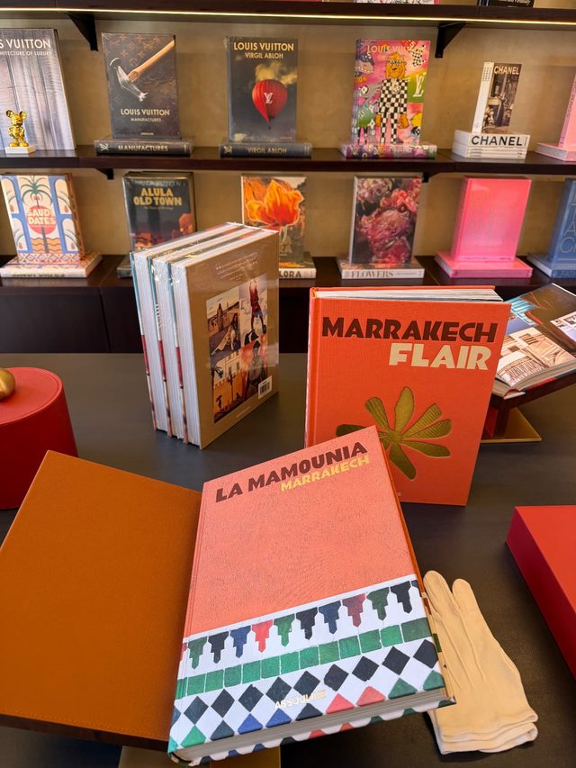 Assouline coffee table books on Marrakech and La Mamounia displayed in a luxury hotel boutique.