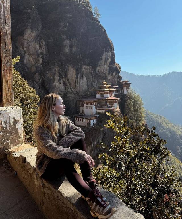 Luxury travel advisor Eva Szoradi at the viewpoint opposite Tiger’s Nest monastery, Paro, Bhutan.