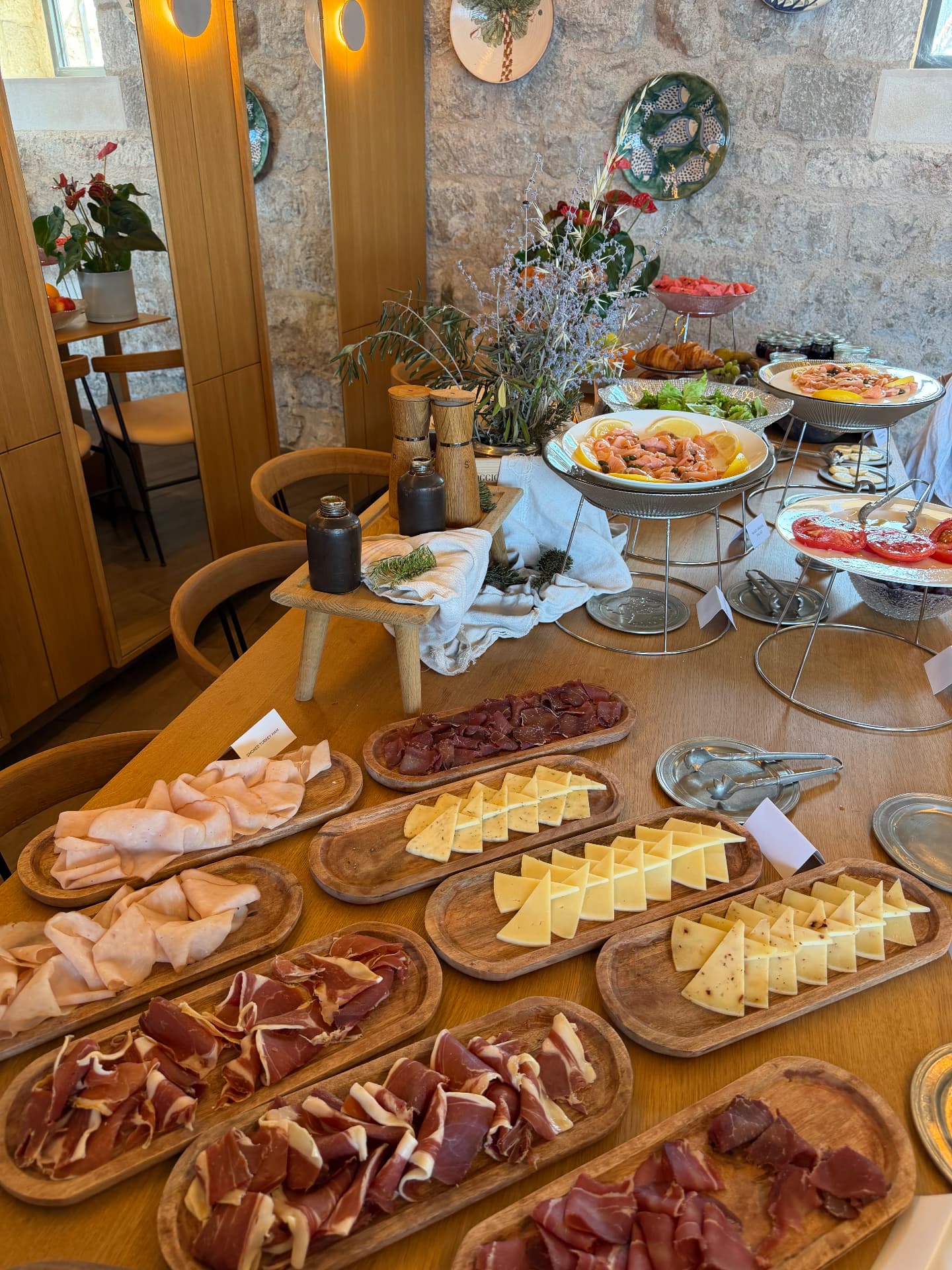 Breakfast buffet of cured meats, cheeses and smoked salmon inside the stone dining room at Mamula Island.