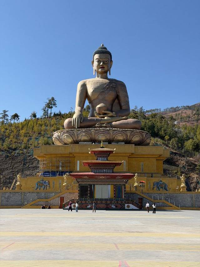 Great Buddha Dordenma statue overlooking Thimphu, Bhutan, beneath a clear blue sky.